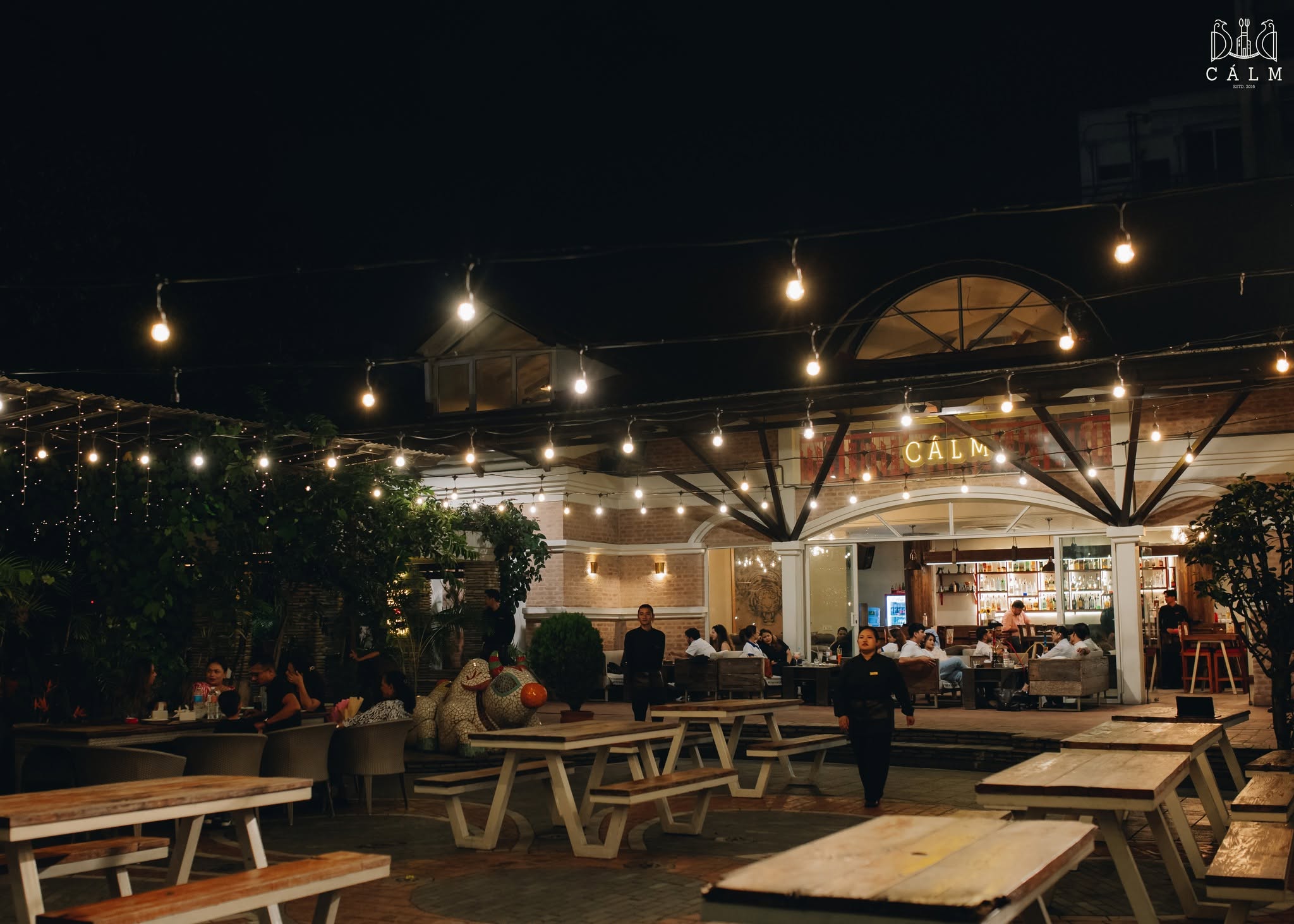 Calm restaurant and beer garden illuminated by string lights in Kathmandu