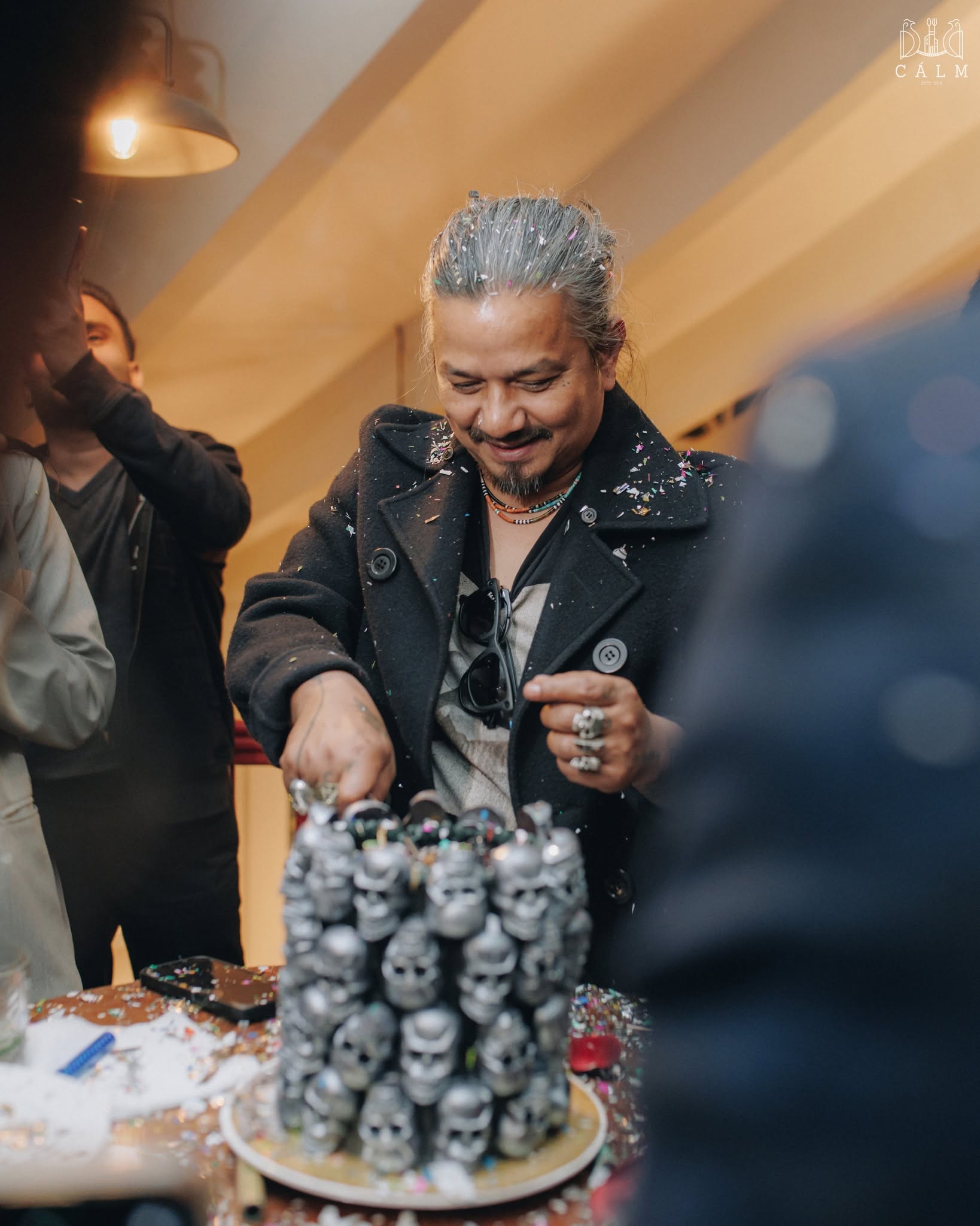 Cutting a celebration cake at Calm