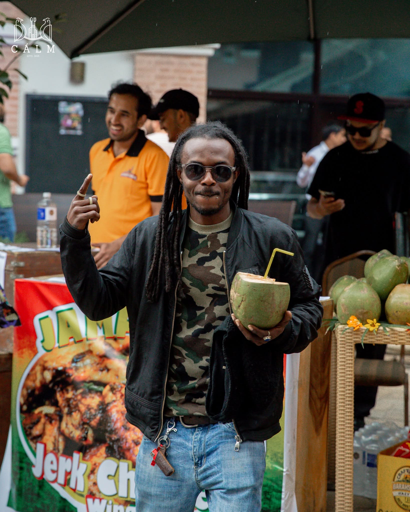 Guest enjoying a coconut drink at Calm
